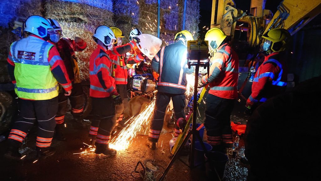 Jonathan Willis being cut free from the forklift by the emergency services at the scene.