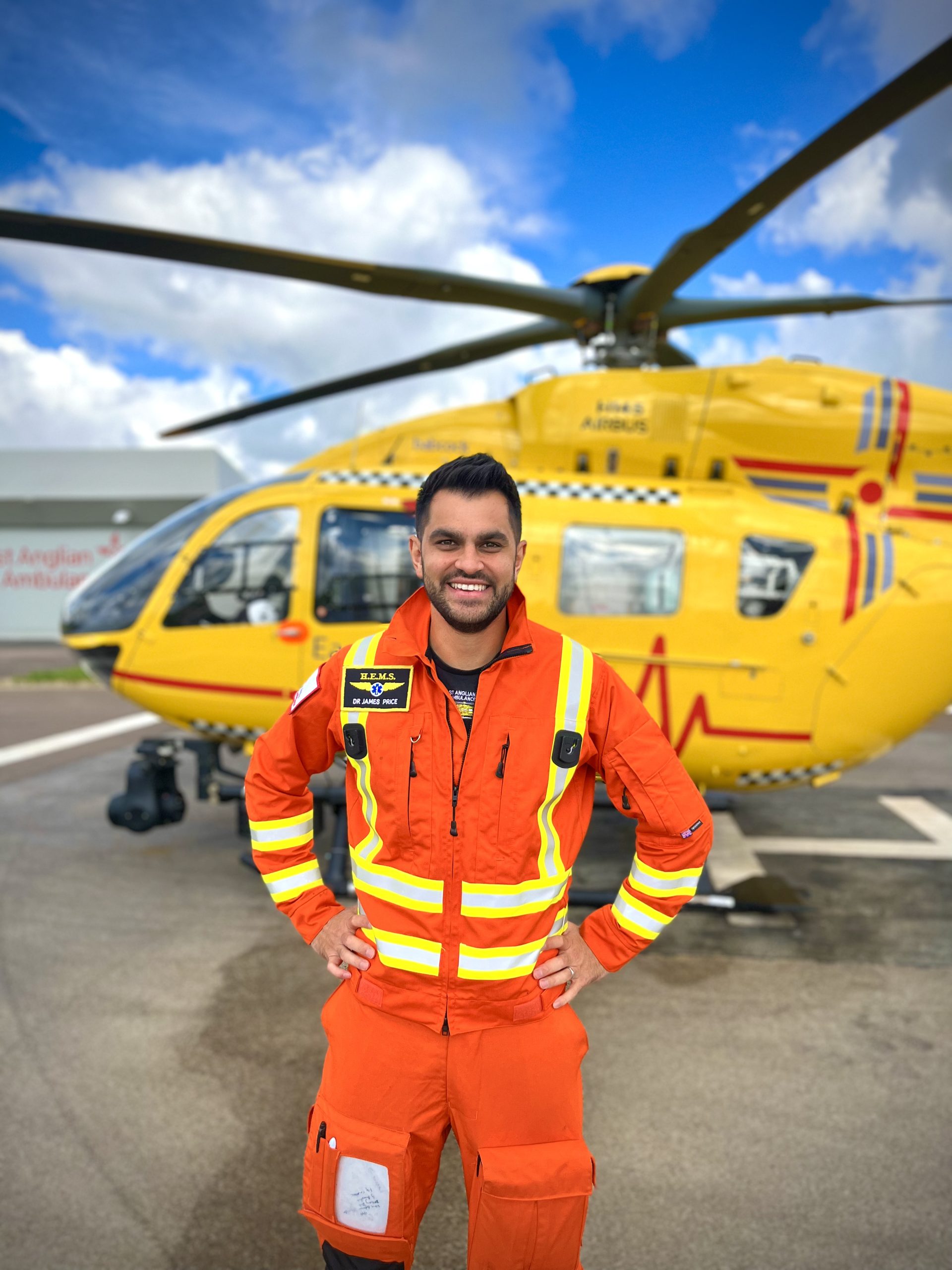 EAAA Doctor James Price standing in front of helicopter