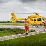 Doctors walking towards helicopter