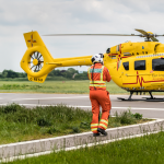 Doctors walking towards helicopter