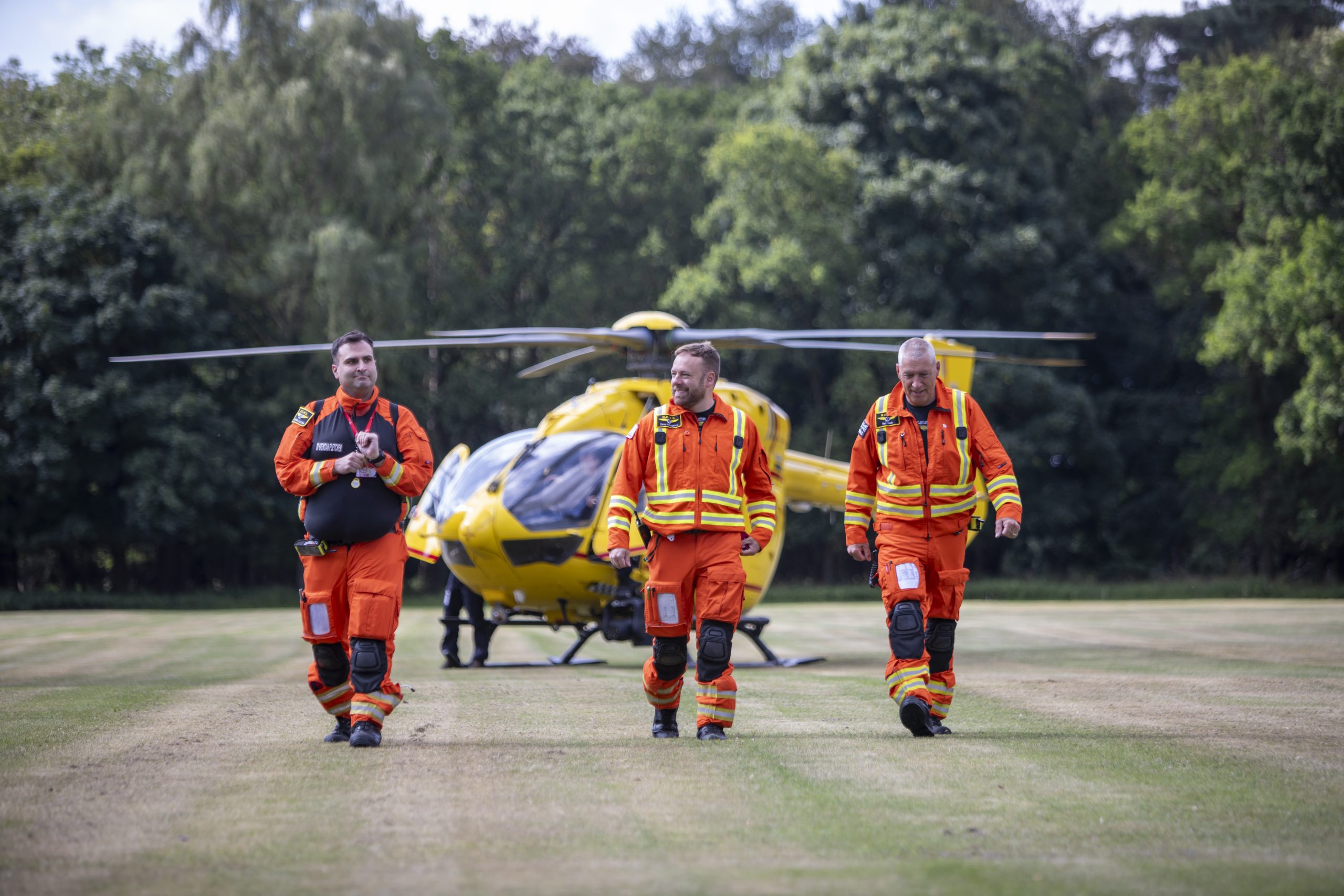 crew-walking-away-from-helicopter-scaled