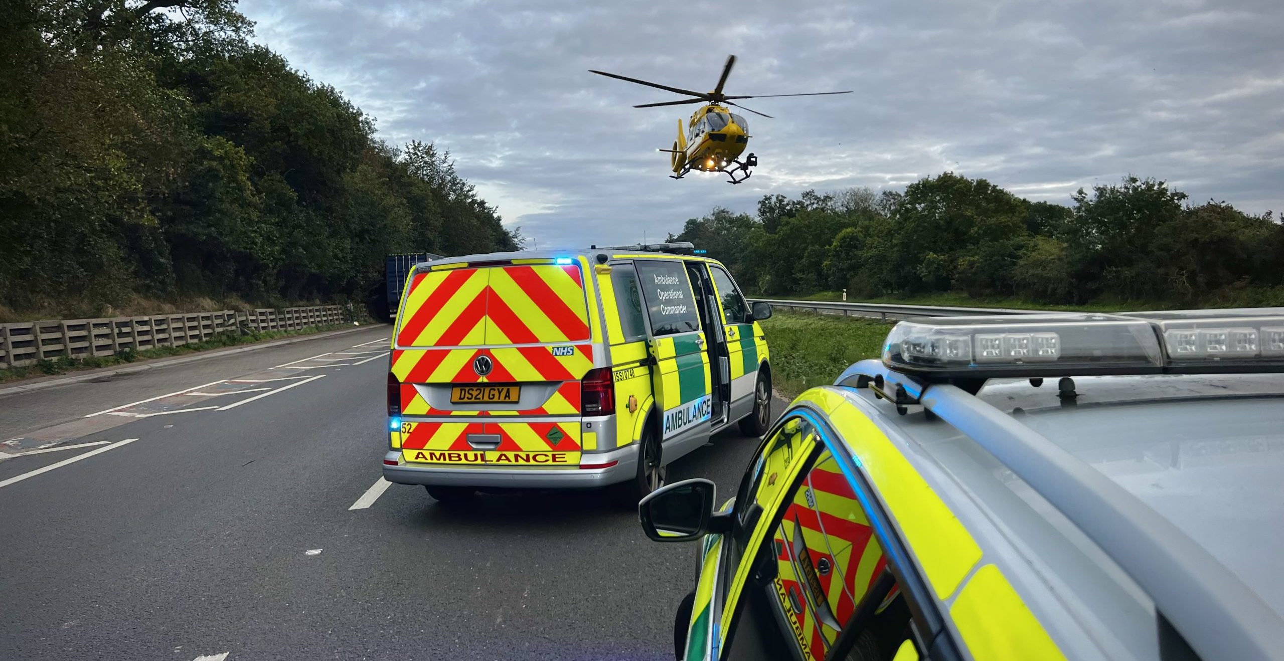 Helicopter on scene with ambulance and police car