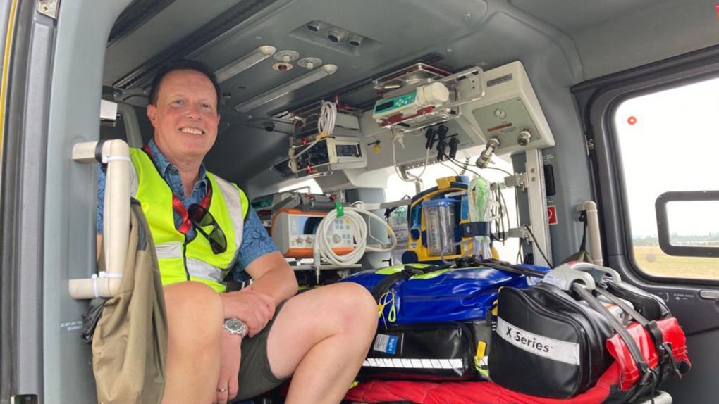 Former patient Dan Gilkes in the back of our H145 Helicopter during a base visit