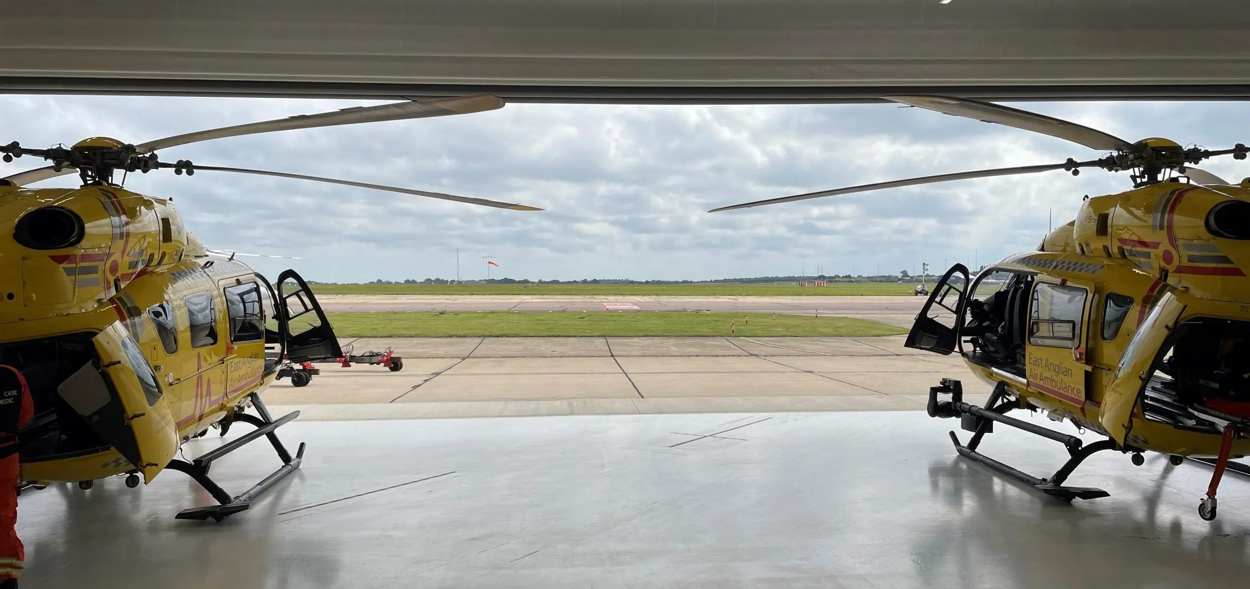 two helicopters at Norwich operating base inside hangar