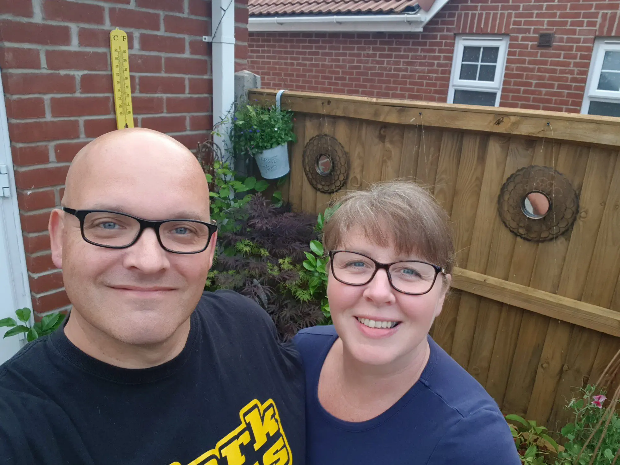 Mark and his wife, Melanie, in their garden at home.
