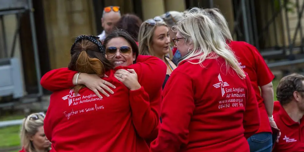 EAAA Staff Hugging at Staff day