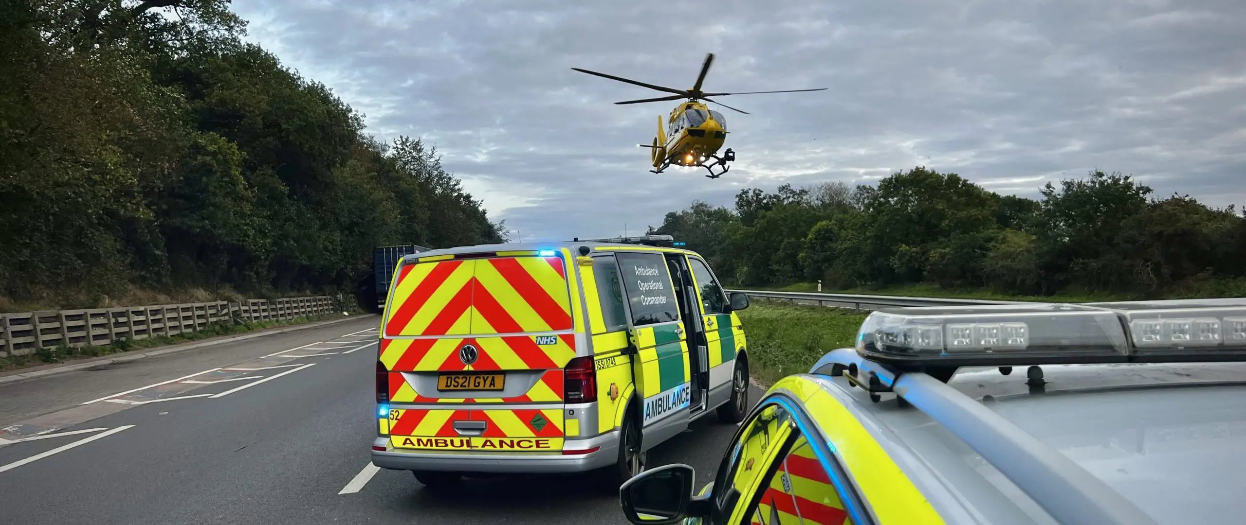 Helicopter on scene with ambulance and police car
