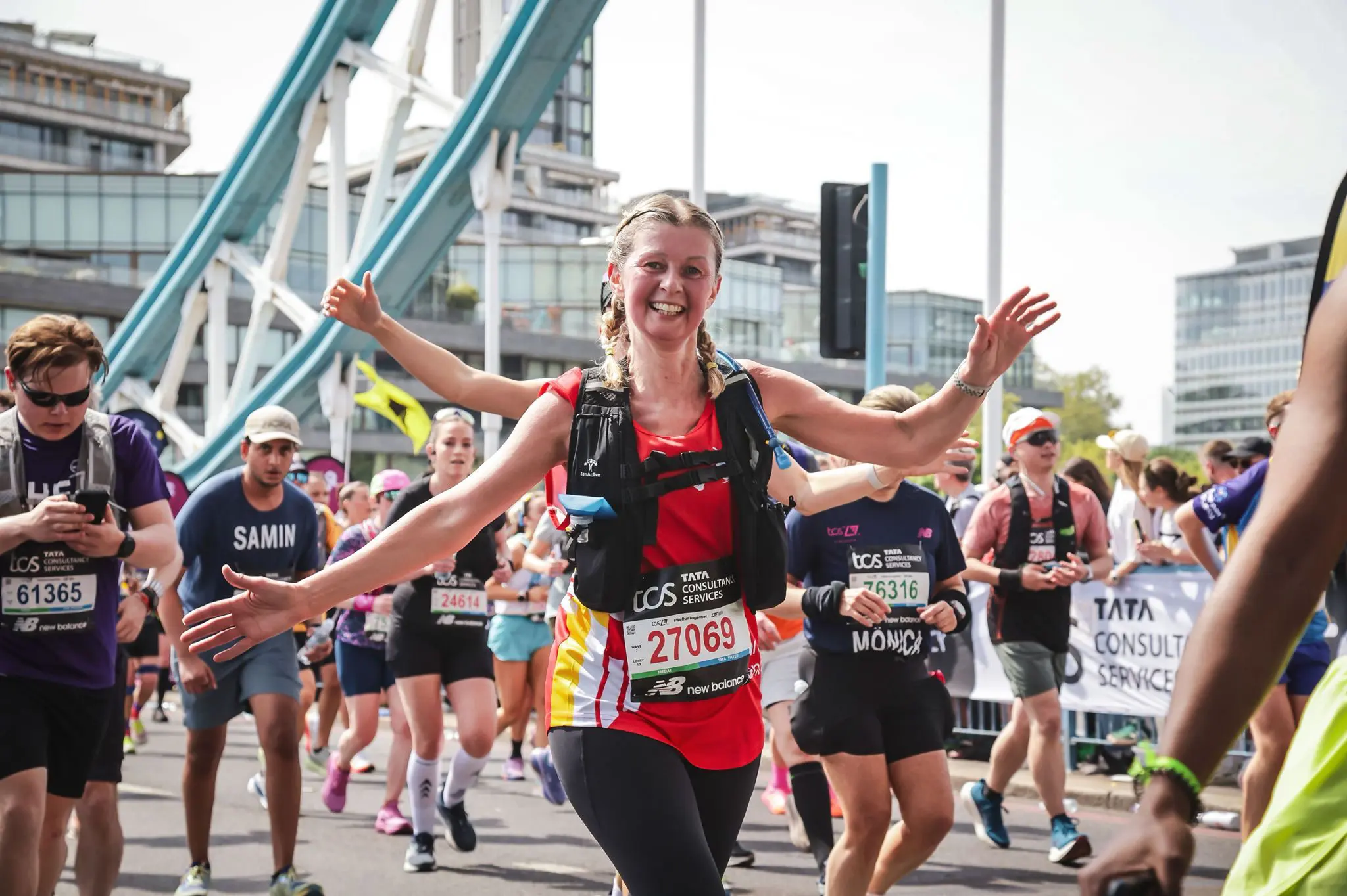 London marathon runner with arms out