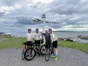 Cyclists Infront of JohnOGroats sign
