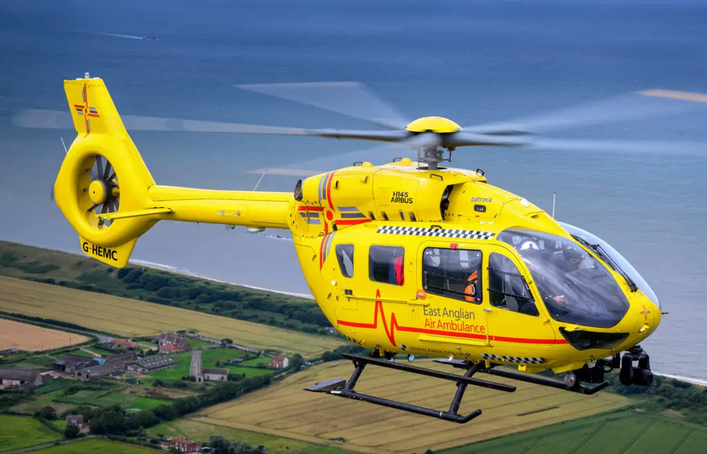 Helicopter flying over coast