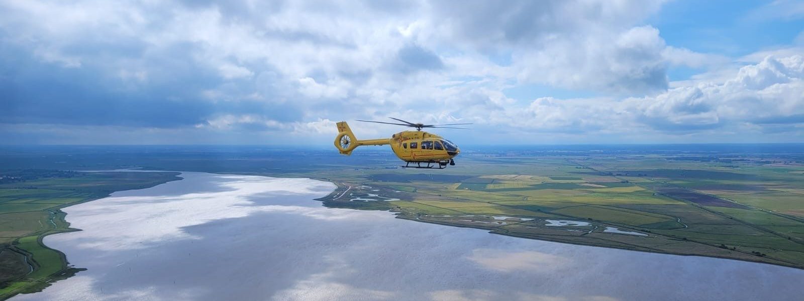 helicopter flying over norfolk countryside