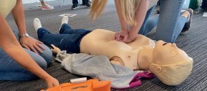 Person delivers chest compressions