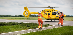 Doctors walking towards helicopter