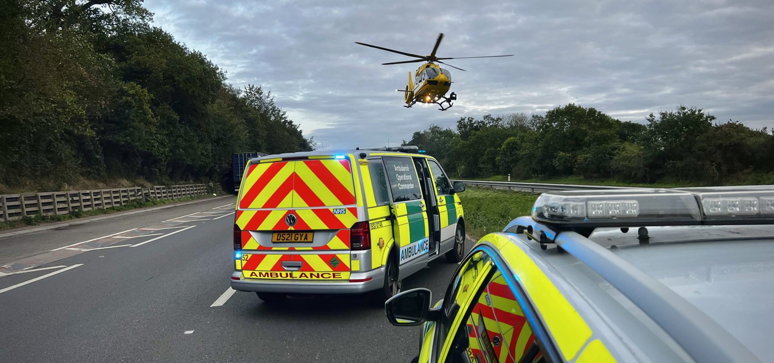 Helicopter on scene with ambulance and police car