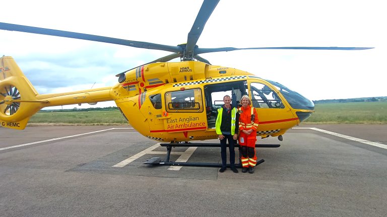 Martin and Dr Patricia in front of helicopter