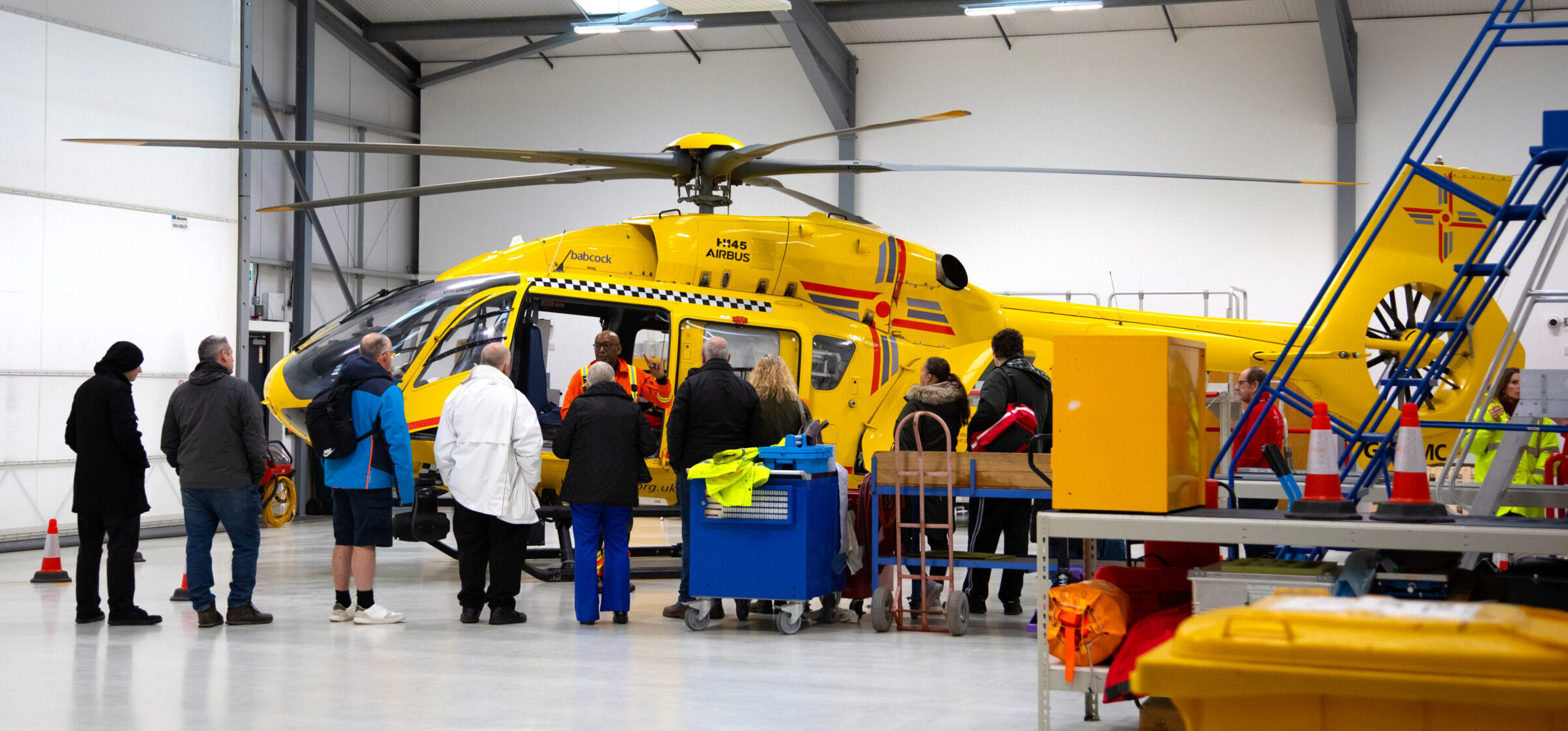 Open day tour infront of helicopter