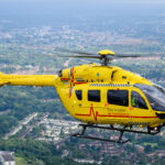 Helicopter flying over houses