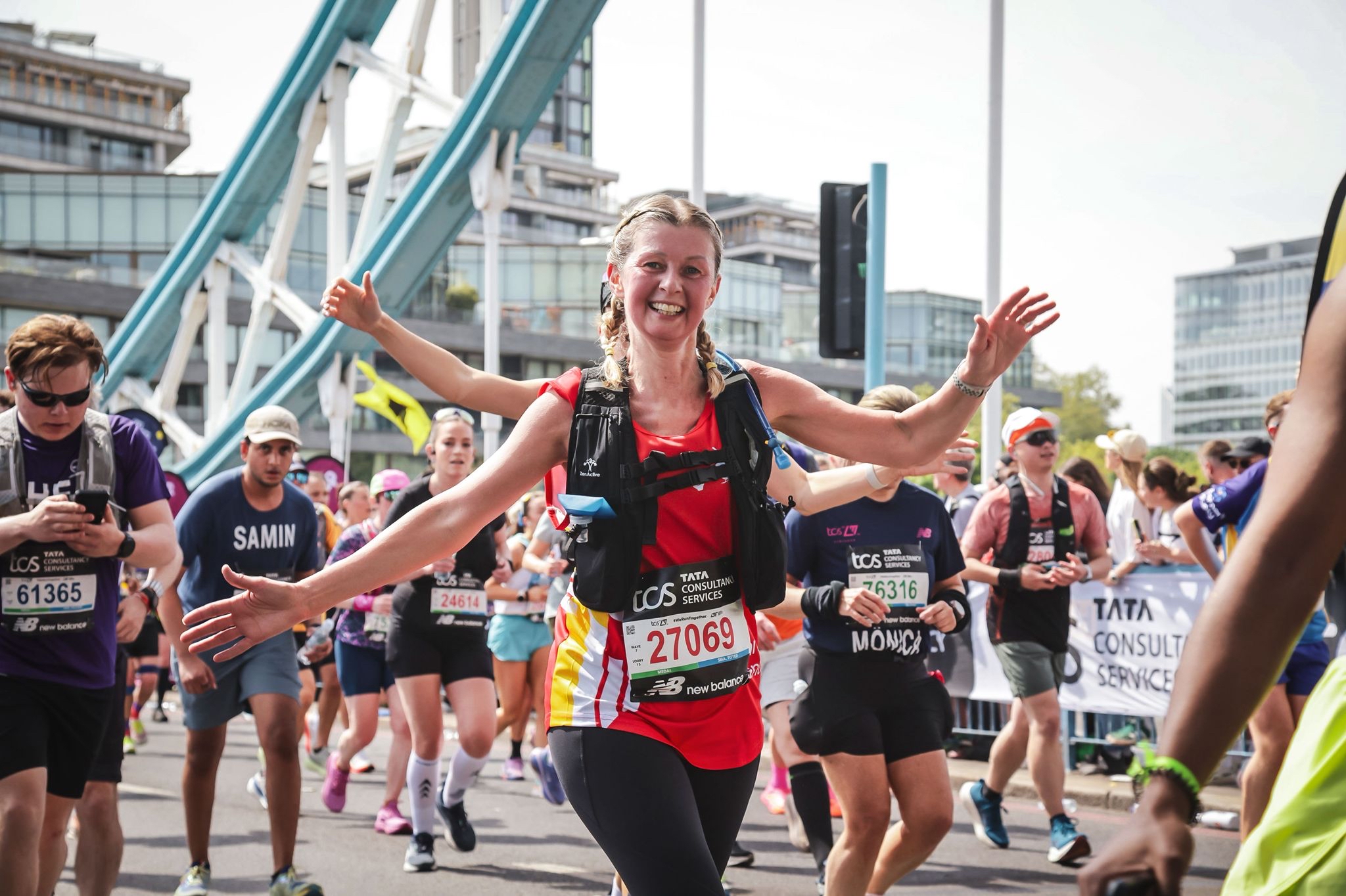 London marathon runner with arms out
