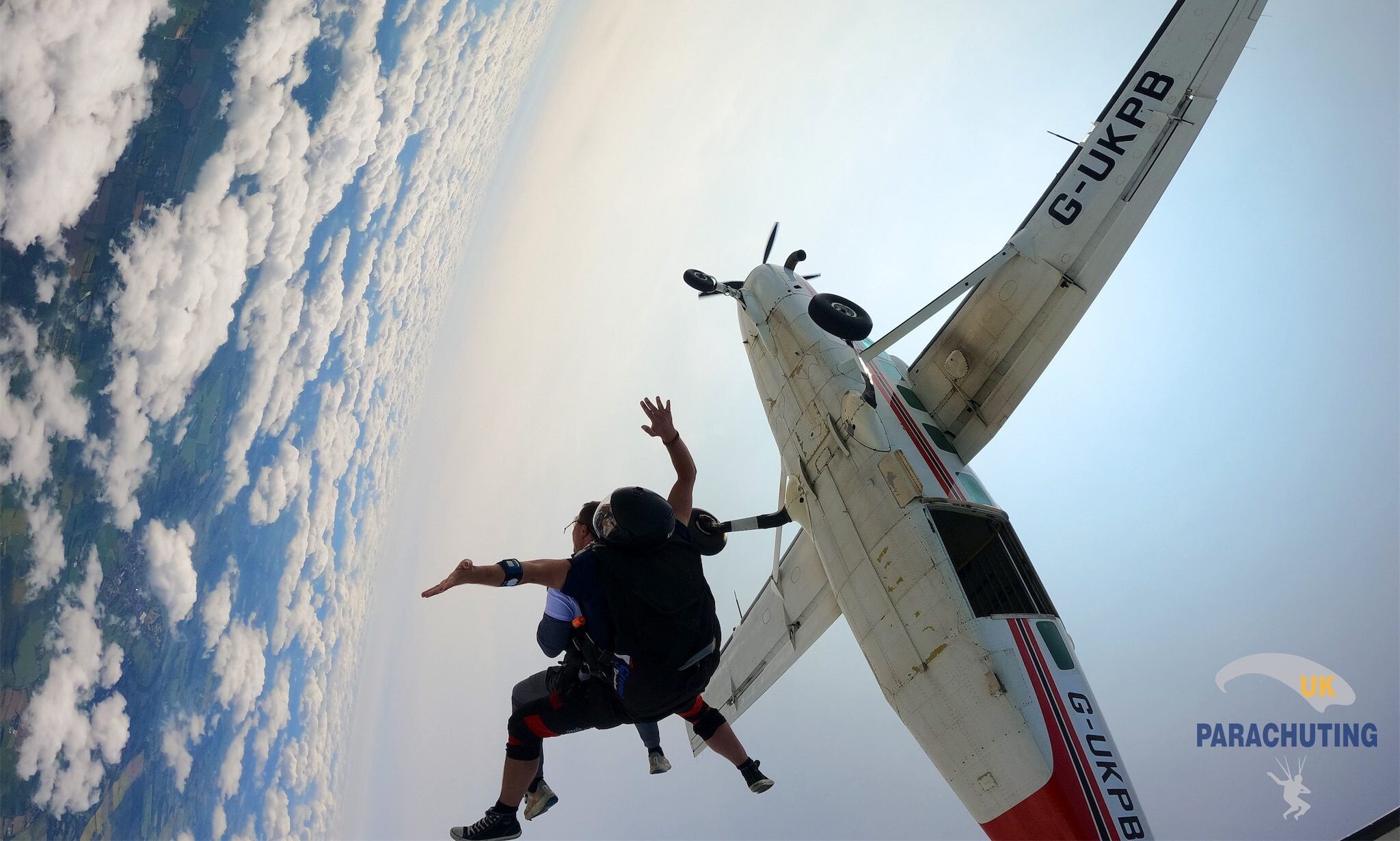 Skydiver jumping out of plane
