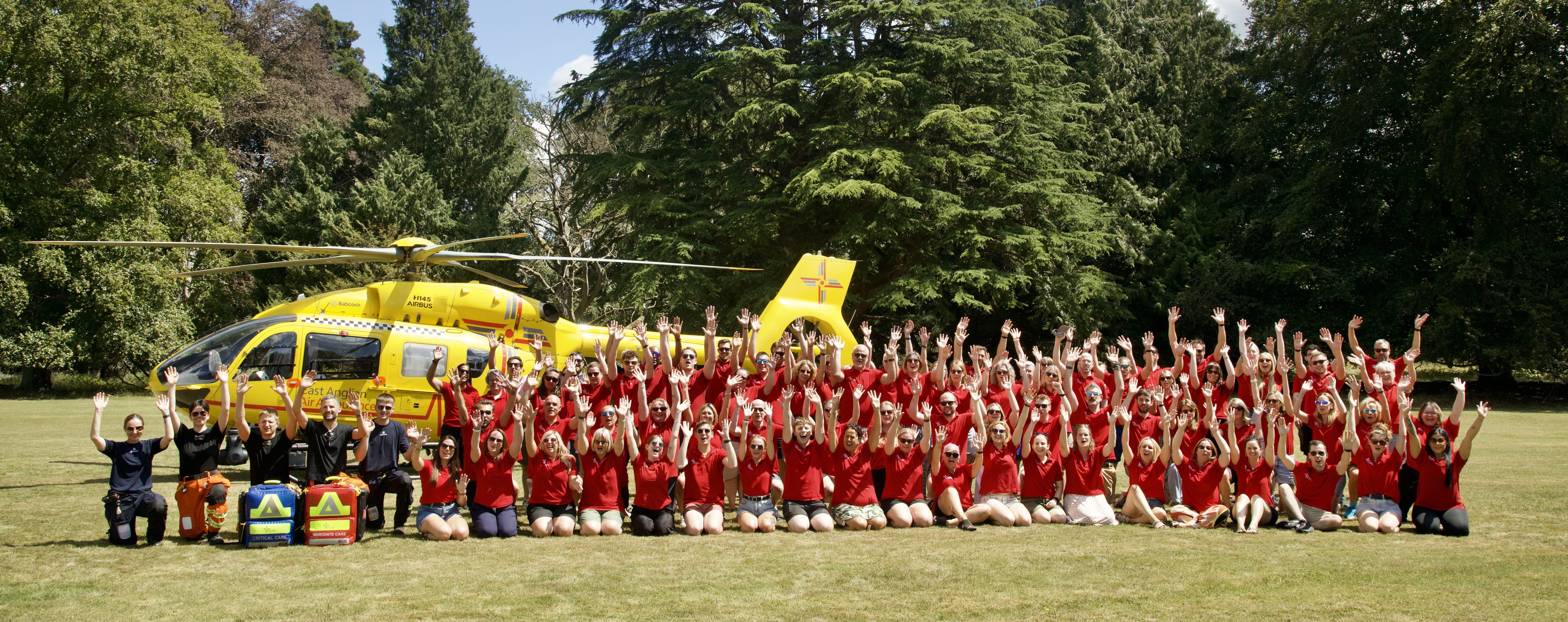EAAA staff in front of heli